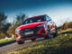 red audi q8 e tron cornering front.jpg